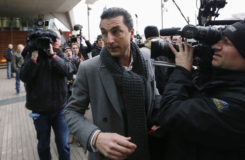 © Reuters. Luyckx, lawyer of Jejoen Bontinck, who is suspected of being a member of "Sharia4Belgium", arrives for the verdict in the trial of the group in Antwerp