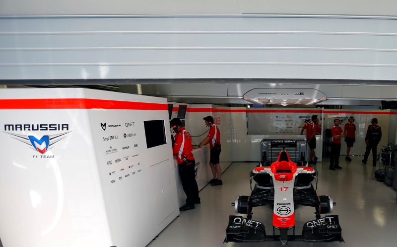 © Reuters. The car of Marussia Formula One driver Jules Bianchi of France is pictured in the garage during the first free practice session of the  Russian F1 Grand Prix in the Sochi Autodrom circuit