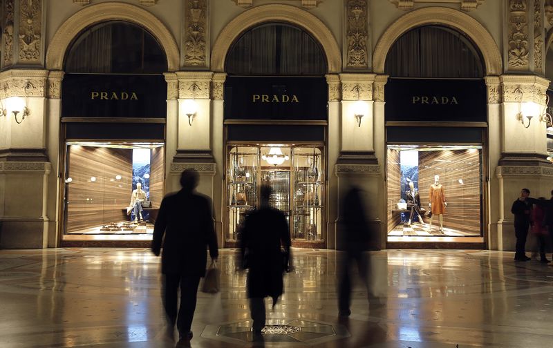 © Reuters. People walk past Prada's fashion store in downtown Milan