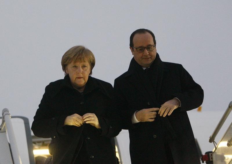 © Reuters. ميركل وأولوند وبوتين يصلون الى مينسك لمحادثات بشأن الازمة الاوكرانية
