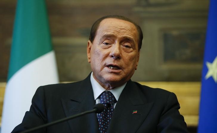 © Reuters. Leader of Forza Italia party Berlusconi talks to reporters at the end of the consultations with Italian Prime Minister-designate Renzi at the Parliament in Rome