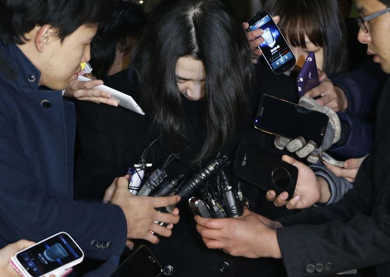 © Reuters. File photo of Cho surrounded by media as she leaves for a detention facility after a court ordered her to be detained, at the Seoul Western District Prosecutor's office