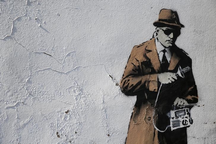 © Reuters. A detail from graffiti art is seen on a wall near the headquarters of Britain's eavesdropping agency, GCHQ, in Cheltenham, western England