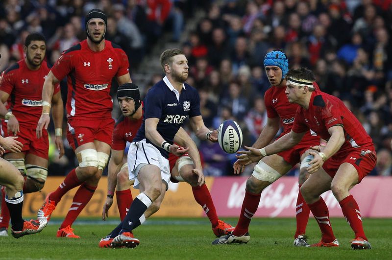 © Reuters. Scotland's Finn Russell is confronted by the Welsh defence during their Six Nations rugby union match at Murrayfield Stadium in Edinburgh