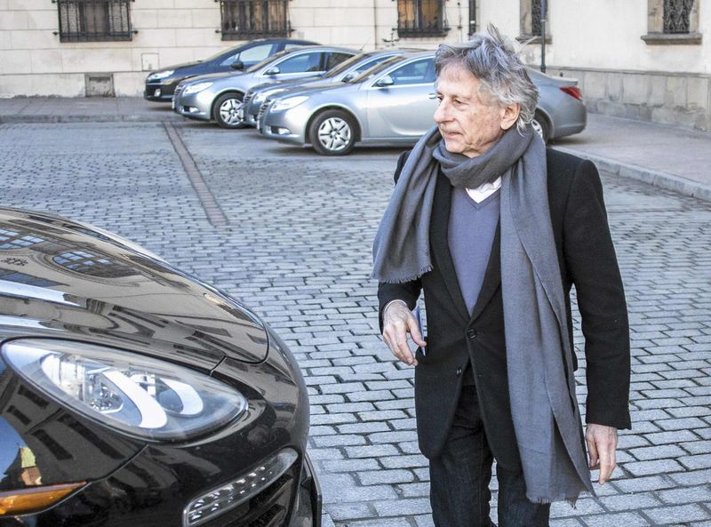 © Reuters. File photo of director Roman Polanski walking on the street after visiting Krakow city council 