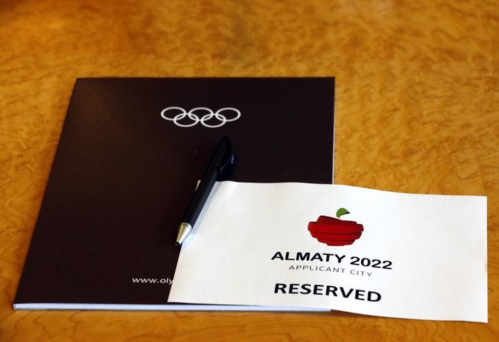 © Reuters. A sign is placed on a table for the Almaty 2022 delegation at the Executive Board meeting in Lausanne