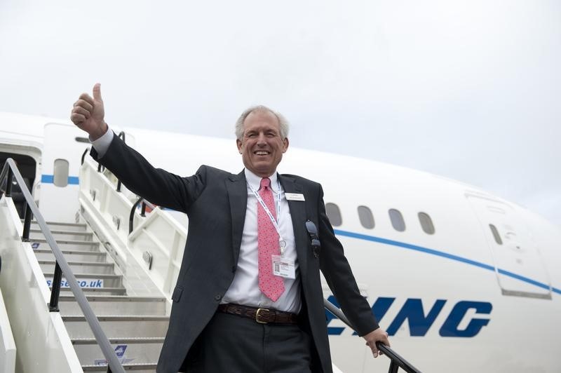 © Reuters. Boeing Chief Executive Officer Jim McNerney gestures to the media as he stands in front of the Boeing 787 Dreamliner aircraft at Farnborough airport in Farnborough, southern England