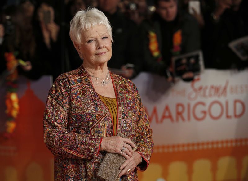 © Reuters. Actress Dench arrives at the Royal Film Performance and world premiere of the film, "The Second Best Exotic Marigold Hotel", at Leicester Square