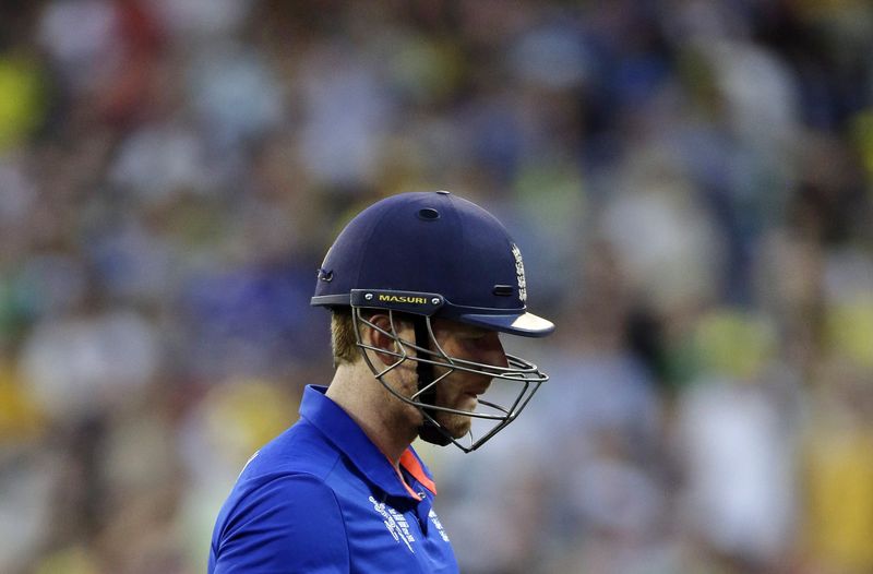 © Reuters. England's captain Morgan reacts as he walks off the field after being dismissed for a duck by Australia's Marsh during their Cricket World Cup match at the Melbourne Cricket Ground