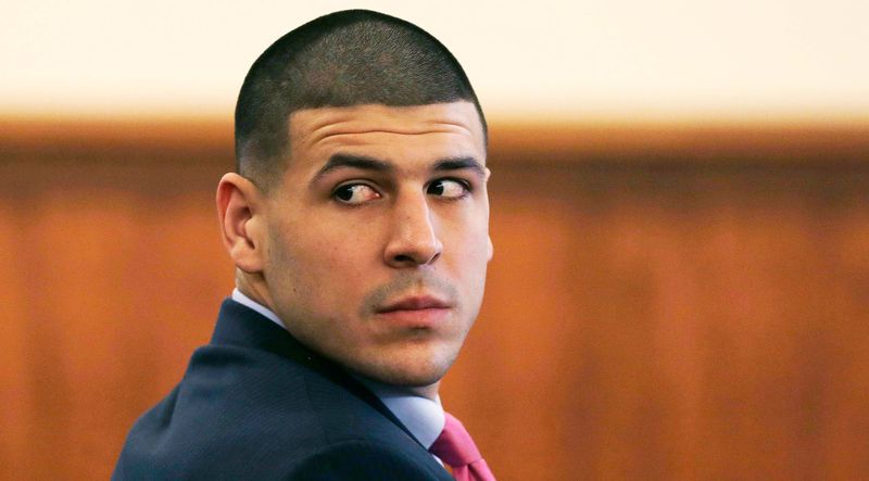 © Reuters. Former NFL player Aaron Hernandez looks back at the gallery during his murder trial at the Bristol County Superior Court in Fall River