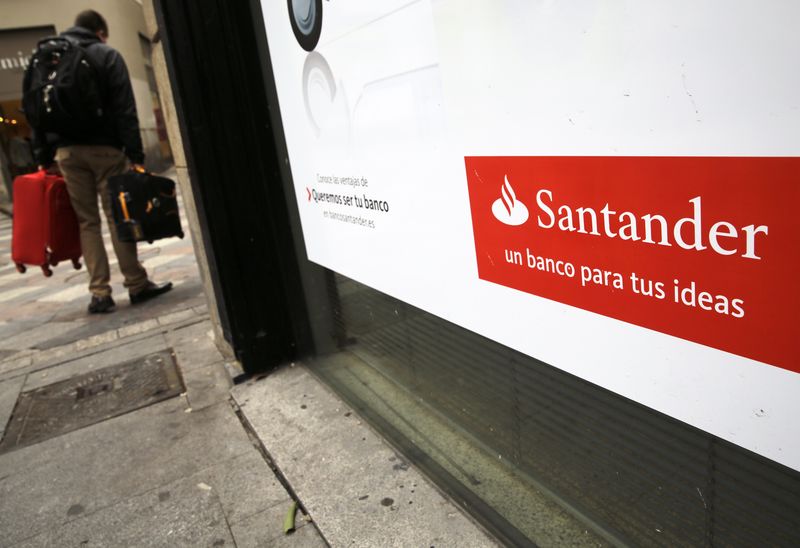 © Reuters. A man walks past a Santander bank branch in central Madrid