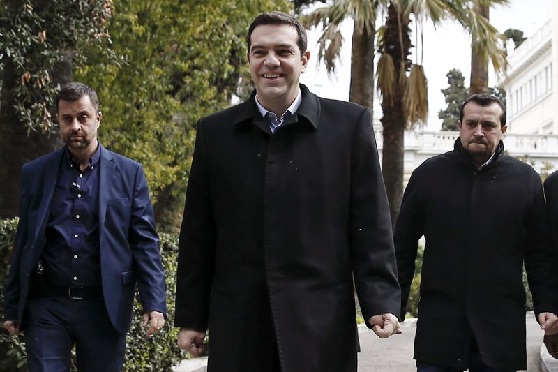 © Reuters. Greek Prime Minister Alexis Tsipras exits after a meeting with Greek President Karolos Papoulias in Athens