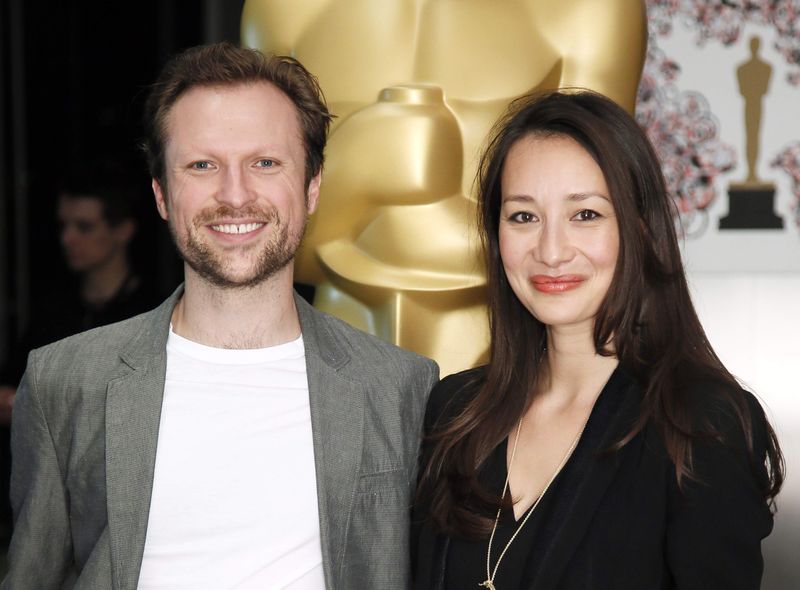 © Reuters. Filmmakers Joanna Natasegara and Orlando von Einsiedel, of the Oscar-nominated documentary feature "Virunga," pose at a reception ahead of the upcoming 87th Academy Awards ceremony in Beverly Hills