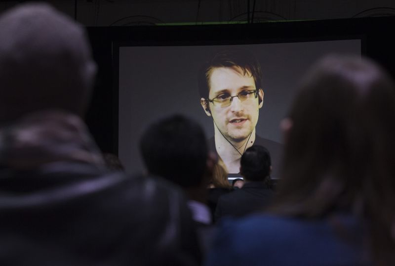© Reuters. File photo of Snowden appearing live via video during a student organized world affairs conference at the Upper Canada College private high school in Toronto
