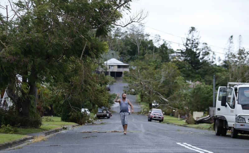 © Reuters. A resident of the coastal town of Yeppoon is pictured on his street full of fallen trees after Cyclone Marcia hit northeastern Australia