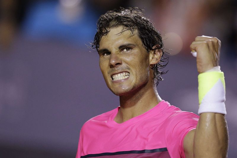 © Reuters. Rafael Nadal of Spain celebrates after winning match against Pablo Cuevas of Uruguay during their men's singles tennis match at the Rio Open tournament in Rio de Janeiro