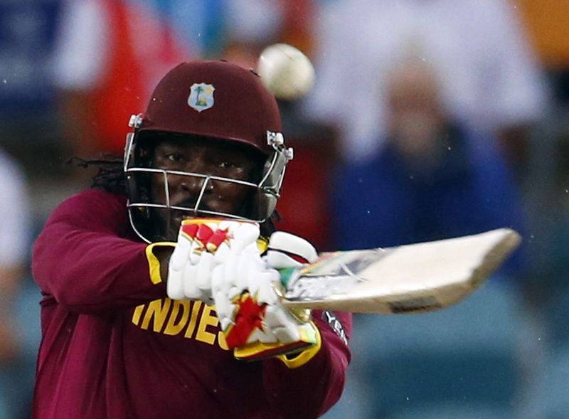 © Reuters. West Indies batsman Chris Gayle plays the ball for six runs during their World Cup Cricket match against Zimbabwe in Canberra