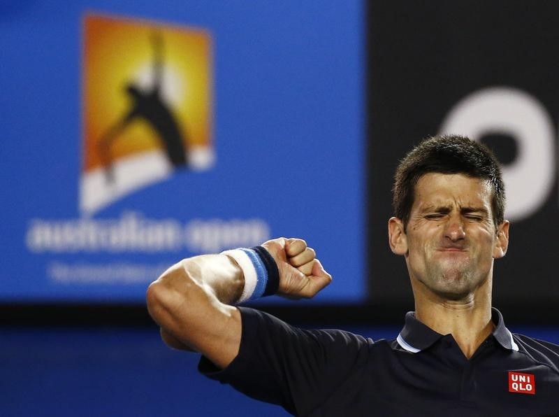 © Reuters. Novak Djokovic of Serbia celebrates after defeating Fernando Verdasco of Spain in their men's singles third round match at the Australian Open 2015 tennis tournament in Melbourne