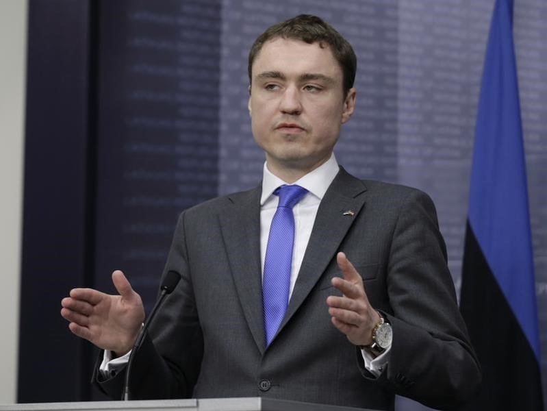 © Reuters. Roivas gestures as he speaks during a news conference in Riga