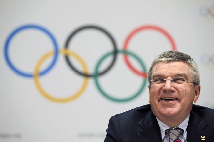 © Reuters. IOC President Bach smiles during a news conference as part of the IOC Executive Board meeting in Monaco