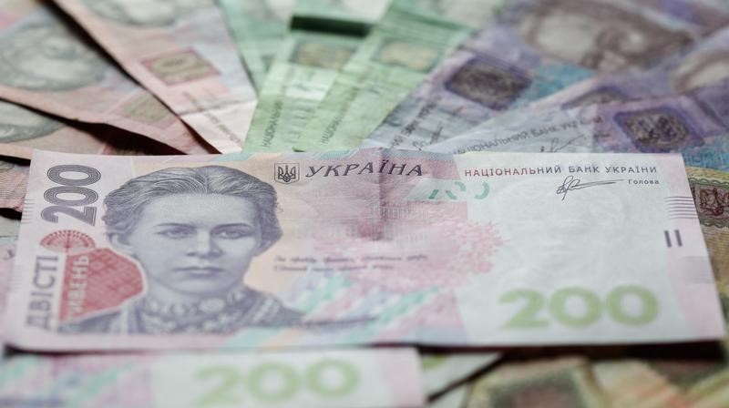 © Reuters. Ukrainian hryvnia banknotes are seen in a photo illustration shot in Kiev