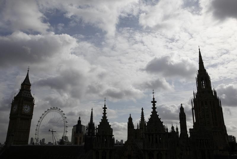 © Reuters. Britain's Houses of Parliament, Big Ben and the London Eye are pictured from the roof of Westminster Abbey in London