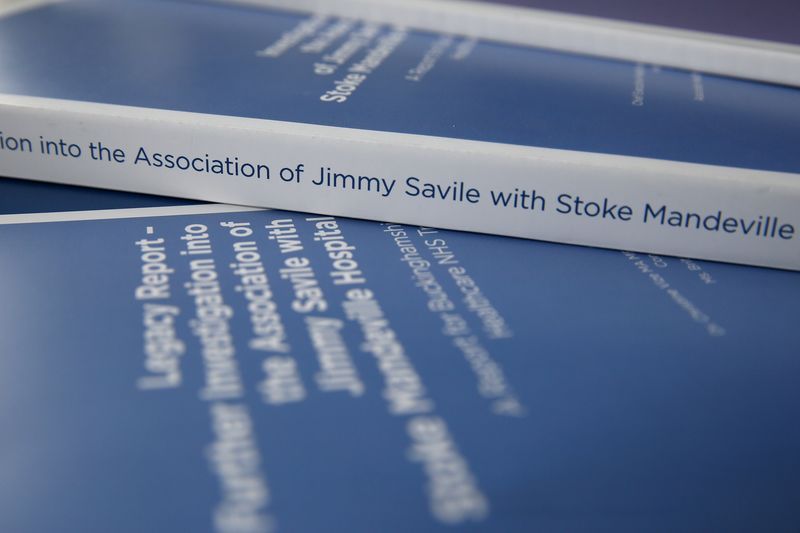 © Reuters. Reports into sexual abuse by Jimmy Savile at Stoke Mandeville hospital are seen before a news conference in central London
