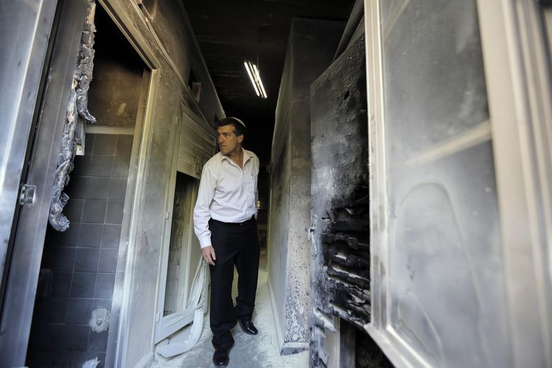 © Reuters. حريق متعمد يخلف أضرارا في معهد لاهوتي بكنيسة جبل صهيون في القدس