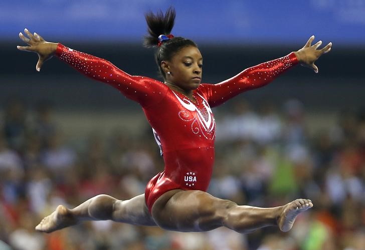© Reuters. Biles of the U.S. competes on the balance beam during the women's team final event at the World Artistic Gymnastics Championships in Nanning