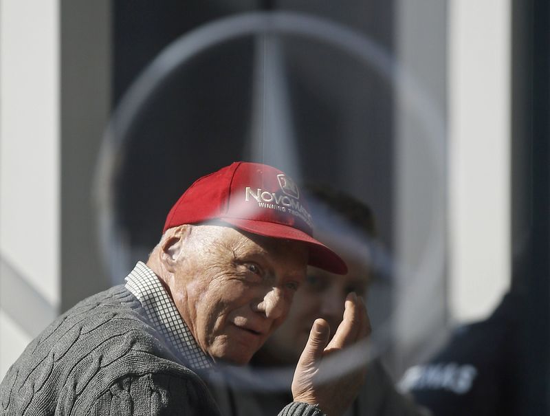 © Reuters. Former Formula One driver Lauda of Germany is pictured speaking though a Mercedes logo during testing session at the Catalunya racetrack in Montmelo