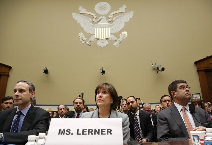 © Reuters. Shulman, Lerner and Wolin take their seats to testify before a House Oversight and Government Reform Committee hearing on targeting of political groups seeking tax-exempt status from the IRS, on Capitol Hill in Washington