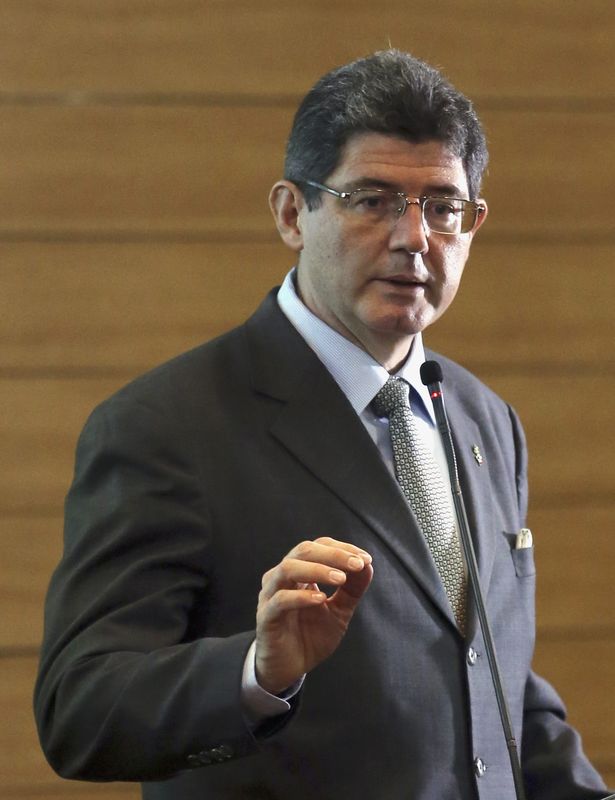 © Reuters. Brazil's Finance Minister Joaquim Levy delivers a speech during a meeting with businessmen of the France-Brazil Chamber of Commerce in Sao Paulo