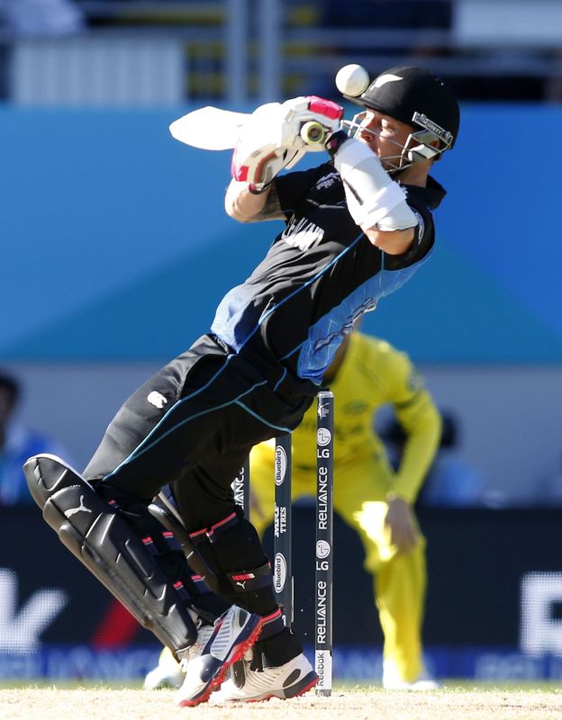 © Reuters. New Zealand's Brendon McCullum plays the ball off his helmet against Australia in their Cricket World Cup match in Auckland