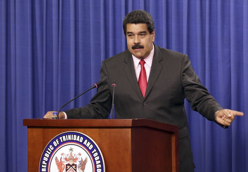 © Reuters. Venezuela's President Nicolas Maduro addresses the audience at the Diplomatic Centre in Port-of-Spain