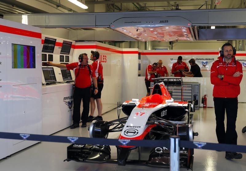 © Reuters. The car of Marussia Formula One driver Jules Bianchi of France is pictured in the garage during the first free practice session of the  Russian F1 Grand Prix in the Sochi Autodrom circuit