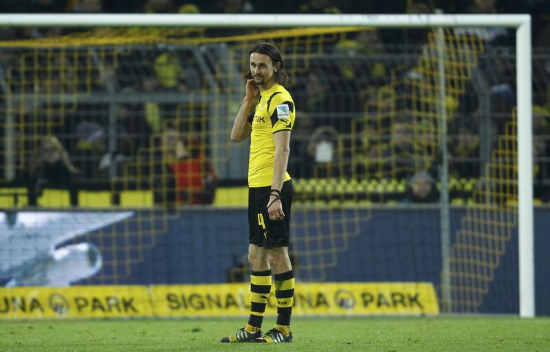 © Reuters. Borussia Dortmund's Subotic reacts following his team's defeat by FC Augsburg in their Bundesliga soccer match in Dortmund