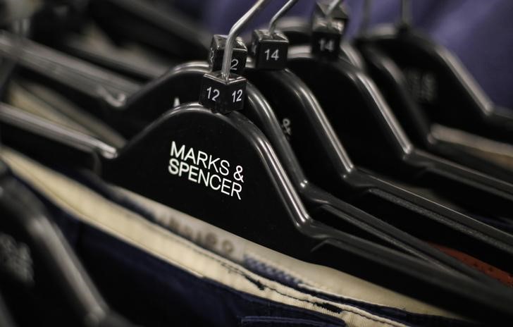© Reuters. Clothes are displayed on hangers in an M&S shop in northwest London