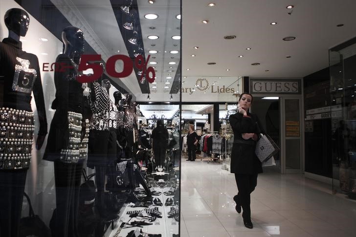 © Reuters. A woman leaves a shop at the commercial Ermou street in central Athens