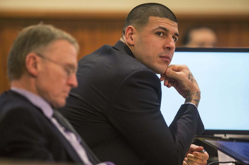 © Reuters. Aaron Hernandez sits with his attorney Charles Rankin during the murder trial of the former New England Patriots tight end in Fall River