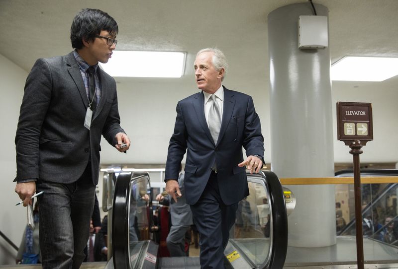 © Reuters. Senator Bob Corker (R-TN)(R) speaks with a reporter as he walks to the Senate Chamber to vote on legislation for funding the Department of Homeland Security