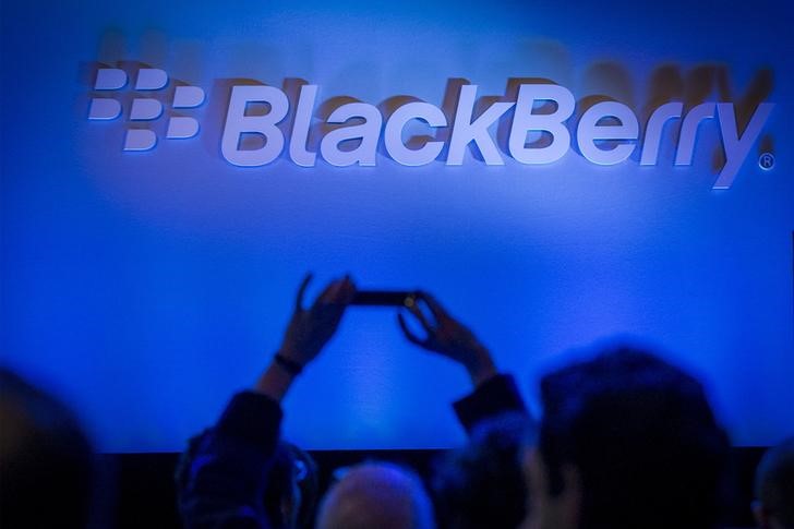© Reuters. An attendee takes a photo during the launch event for the new Blackberry Classic smartphone in New York