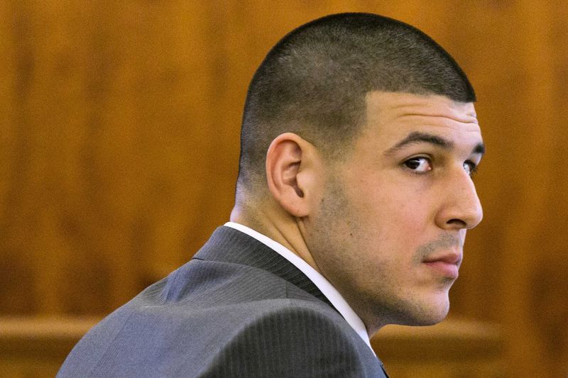 © Reuters. Former NFL player Aaron Hernandez looks at the prosecutor during his murder trial at the Bristol County Superior Court in Fall River