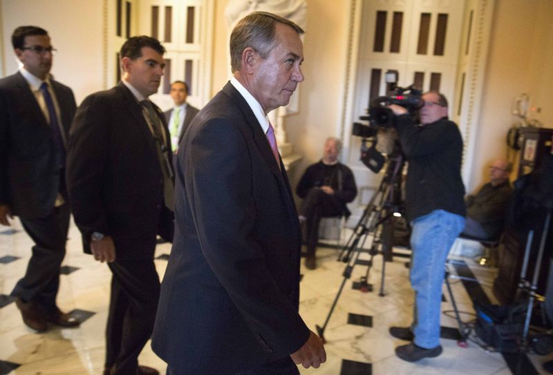 © Reuters. Speaker of the House John Boehner (R-OH) walks to the House Chamber before a vote on funding the Department of Homeland Security, in Washington