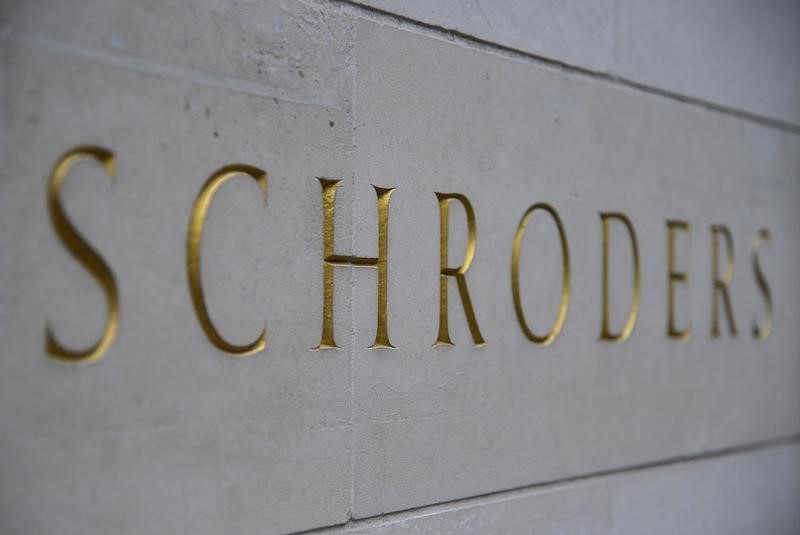 © Reuters. A Schroders sign is seen outside a building in the City of London