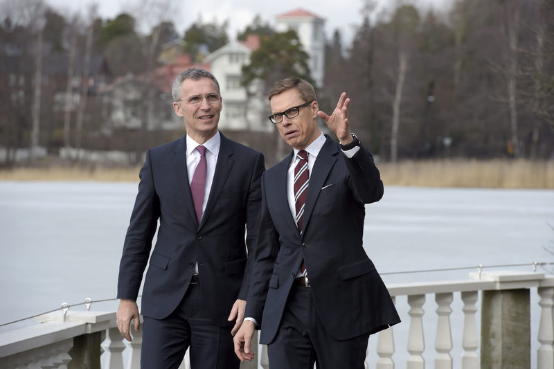 © Reuters. Finnish Prime Minister Alexander Stubb talks with NATO Secretary-General Jens Stoltenberg in Helsinki