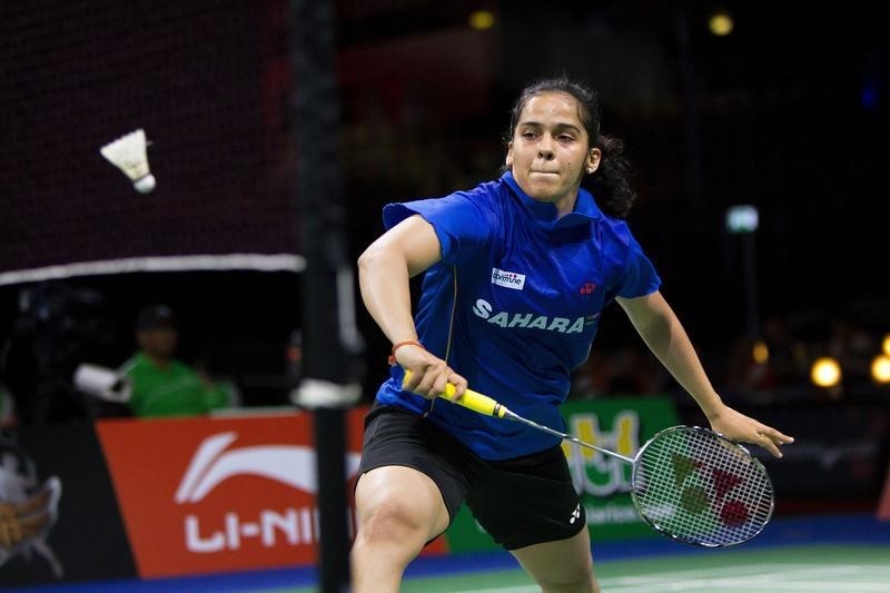 © Reuters. Nehwal of India plays against Li of China during their womens' singles quarter-final match at the Badminton World Championships in Copenhagen