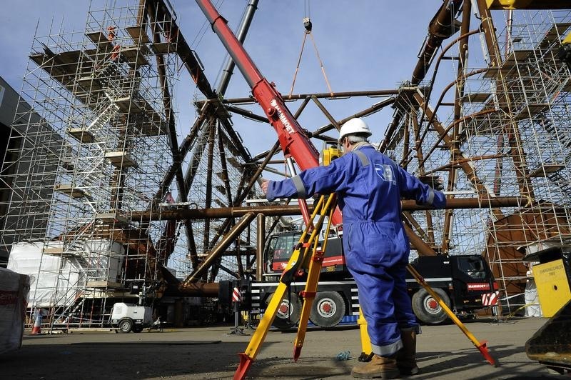 © Reuters. A surveyor checks part of the jacket section of Centrica's York platform at the Heerema plant in Hartlepool, northern England