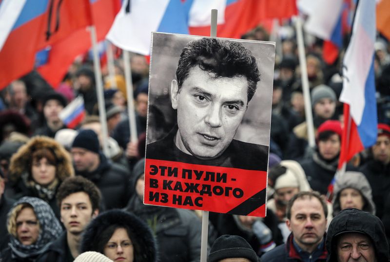 © Reuters. A portrait of Kremlin critic Boris Nemtsov, who was shot dead on Friday night, is seen during a march to commemorate him in central Moscow