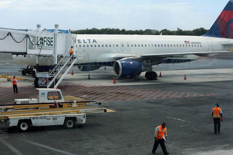 © Reuters. A Delta airliner is parked on the tarmac after making an emergency landing at the Augusto C. Sandino International Airport in Managua
