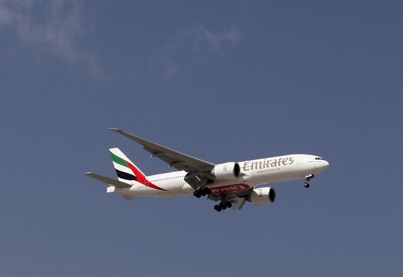 © Reuters. An Emirates Airlines plane lands at the Emirates terminal at Dubai International Airport